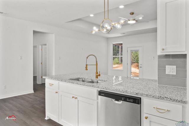 kitchen featuring pendant lighting, white cabinetry, sink, and stainless steel dishwasher