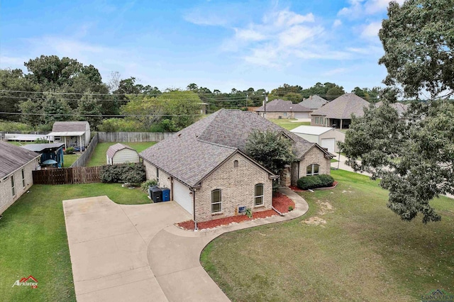 view of front facade featuring a front yard and a garage