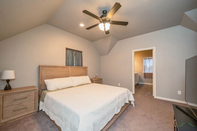207 Reel Rd, Longview, TX 75604 - bedroom featuring lofted ceiling, dark carpet, a ceiling fan, and ensuite bath