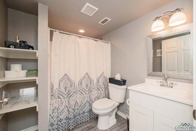 207 Reel Rd, Longview, TX 75604 - full bath featuring vanity, wood finished floors, curtained shower, and recessed lighting