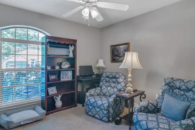 sitting room with carpet and ceiling fan