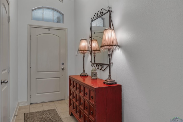 foyer entrance featuring light tile patterned floors