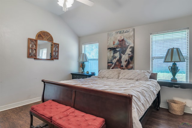 bedroom with vaulted ceiling, baseboards, dark wood-type flooring, and a ceiling fan