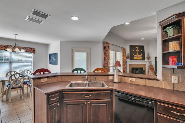 kitchen with a sink, dark countertops, visible vents, black dishwasher, and light tile patterned floors