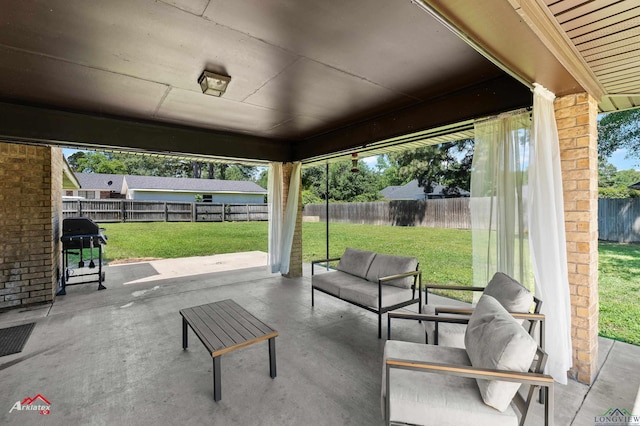view of patio with grilling area and an outdoor hangout area
