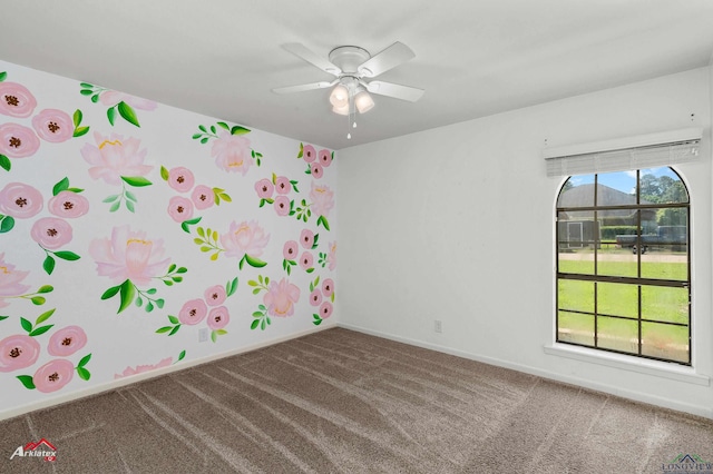 spare room featuring carpet floors, baseboards, and ceiling fan