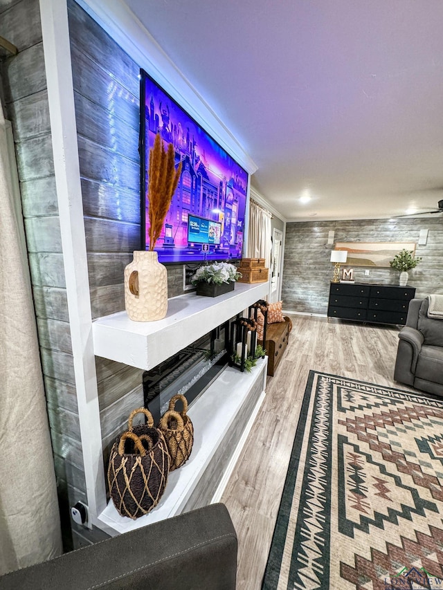 interior space with wood finished floors and ornamental molding