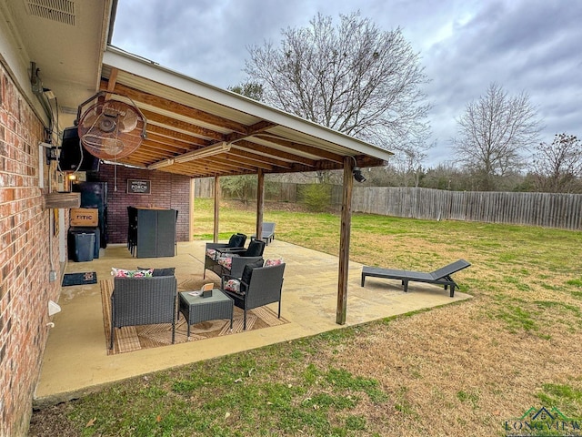 view of patio / terrace featuring fence and an outdoor hangout area