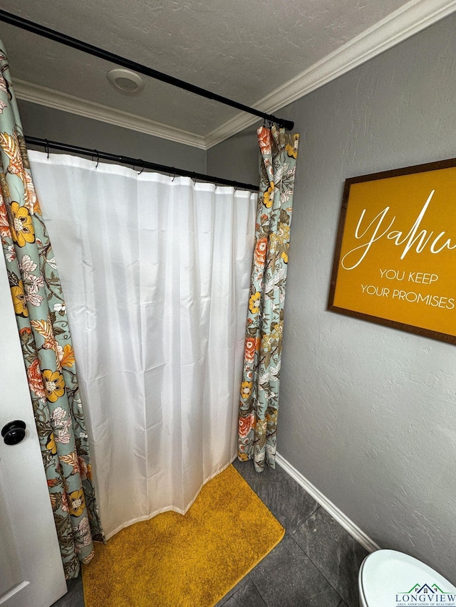 full bathroom featuring baseboards, a textured ceiling, crown molding, toilet, and a textured wall