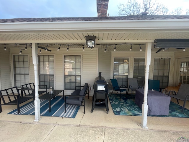 view of patio featuring ceiling fan and an outdoor living space