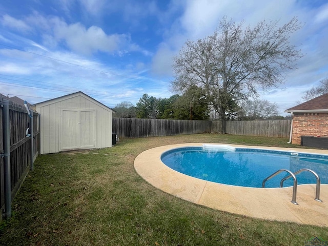 view of pool with a yard and a shed