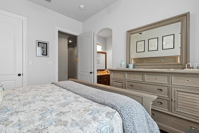 159 Jacobin Creek Dr, Gilmer, TX 75645 - bedroom featuring arched walkways and ensuite bath