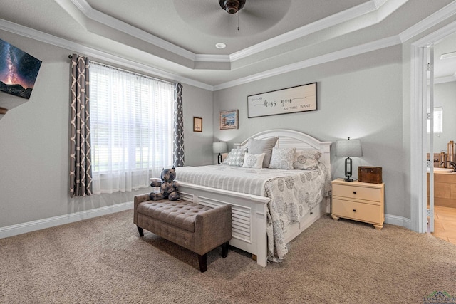 159 Jacobin Creek Dr, Gilmer, TX 75645 - bedroom featuring multiple windows, ornamental molding, a tray ceiling, light carpet, and connected bathroom
