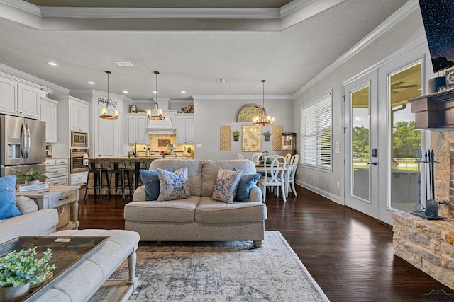 159 Jacobin Creek Dr, Gilmer, TX 75645 - living room with a chandelier, dark wood-style flooring, ornamental molding, and recessed lighting