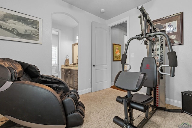 159 Jacobin Creek Dr, Gilmer, TX 75645 - workout room with carpet flooring and arched walkways