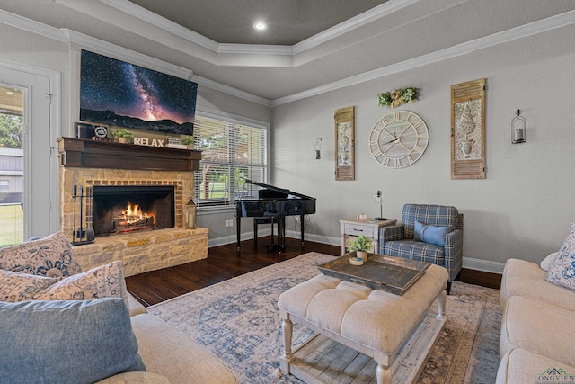 159 Jacobin Creek Dr, Gilmer, TX 75645 - living room with wood finished floors, ornamental molding, a fireplace, a tray ceiling, and recessed lighting
