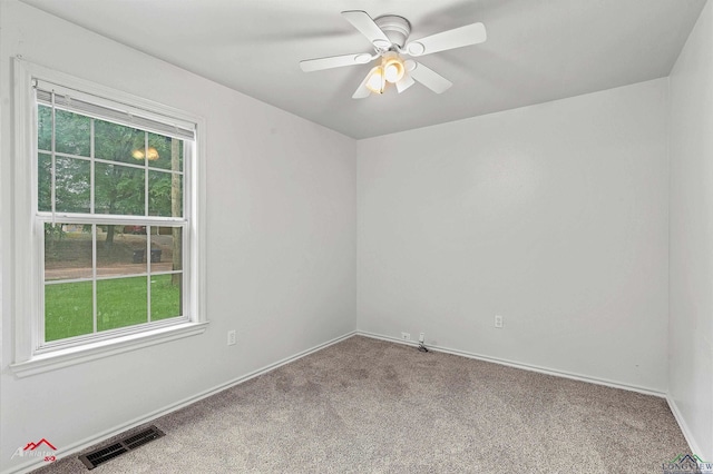 209 Norton Dr, Longview, TX 75602 - unfurnished room featuring carpet floors, a ceiling fan, and baseboards