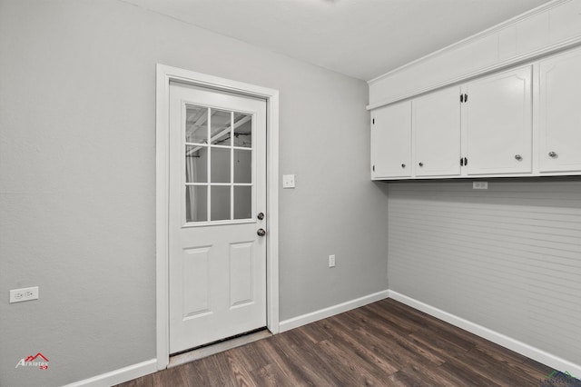 clothes washing area featuring dark wood-type flooring