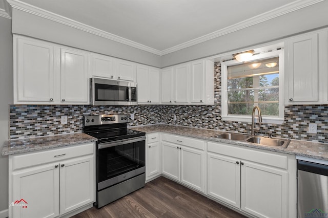 kitchen featuring stainless steel appliances, dark hardwood / wood-style flooring, sink, and white cabinets