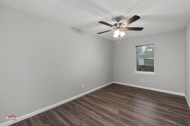 spare room with ceiling fan and dark hardwood / wood-style floors