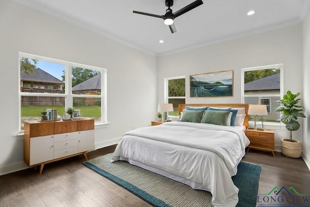 bedroom featuring ceiling fan, dark hardwood / wood-style flooring, and ornamental molding