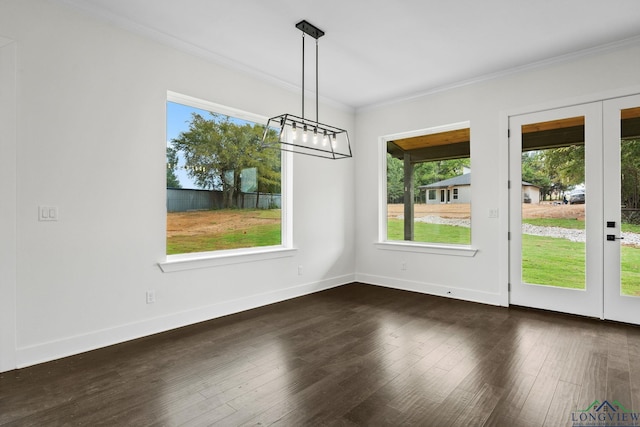 unfurnished dining area featuring dark hardwood / wood-style floors and ornamental molding