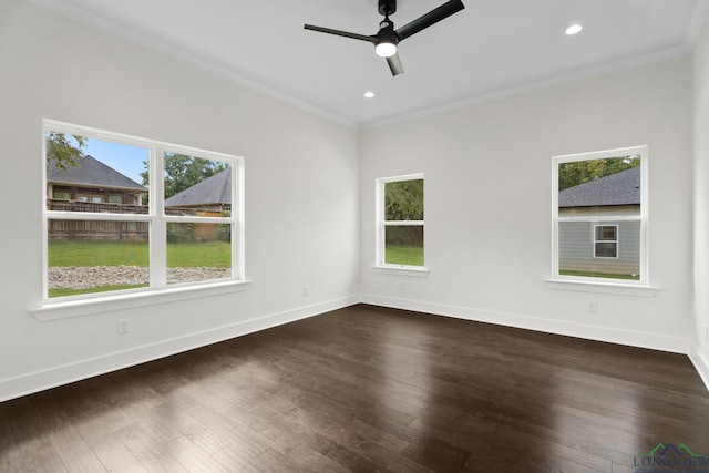 empty room featuring ceiling fan, ornamental molding, and dark hardwood / wood-style floors