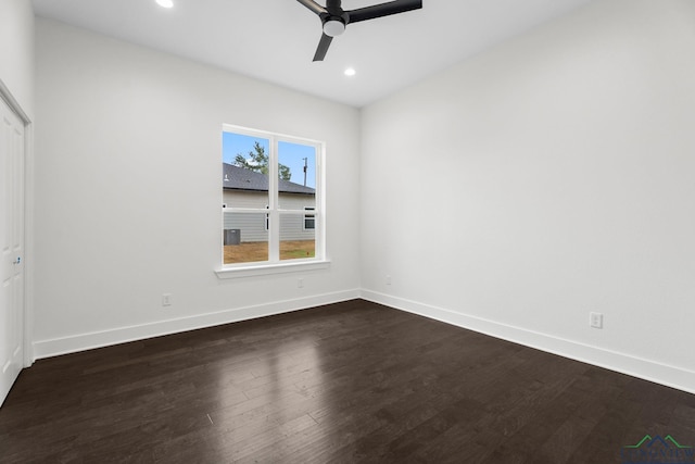 unfurnished room with ceiling fan and dark hardwood / wood-style flooring