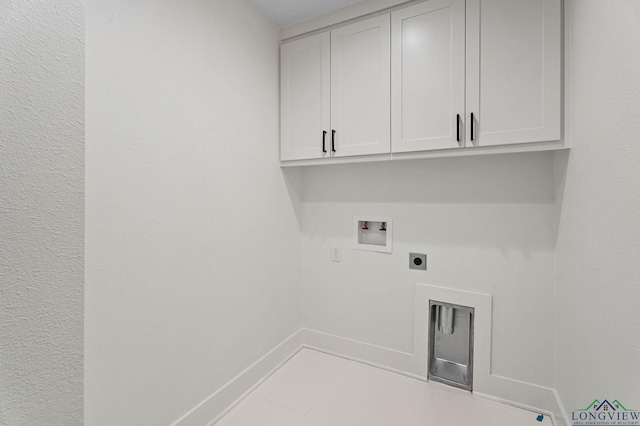 clothes washing area featuring light tile patterned floors, hookup for an electric dryer, hookup for a washing machine, and cabinets