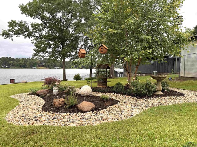 2012 W Lake Dr, Gladewater, TX 75647 - view of yard featuring a water view