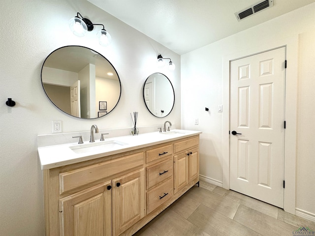 2012 W Lake Dr, Gladewater, TX 75647 - bathroom with double vanity and baseboards