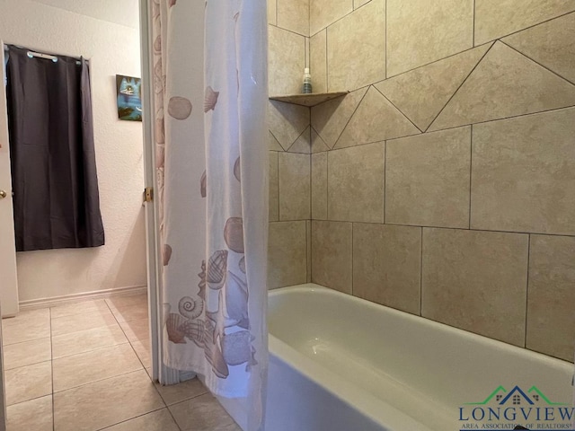 bathroom with tile patterned flooring and shower / tub combo with curtain