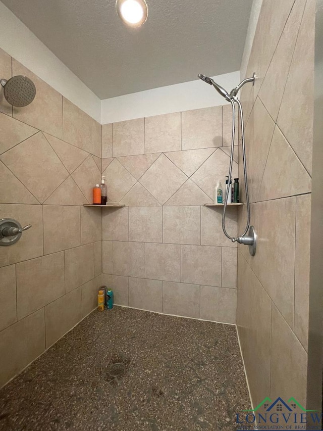 bathroom with a tile shower