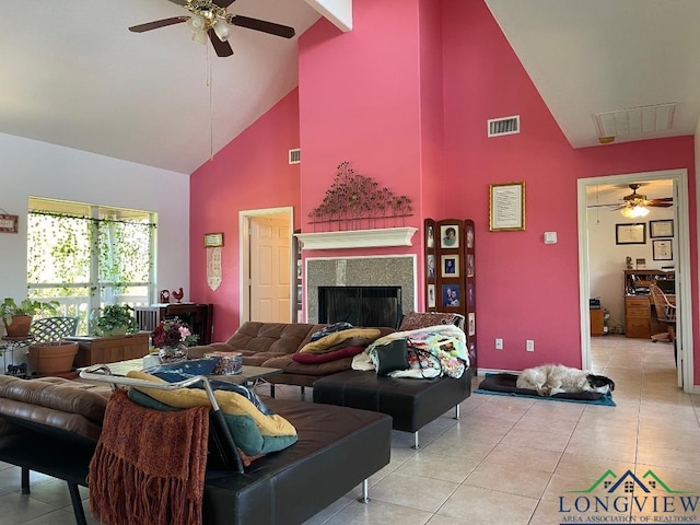 tiled living room with ceiling fan, beamed ceiling, and high vaulted ceiling