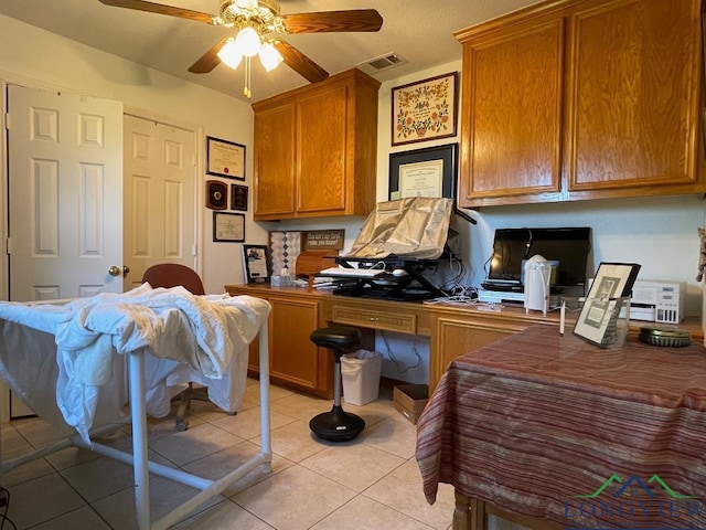 home office featuring ceiling fan and light tile patterned floors