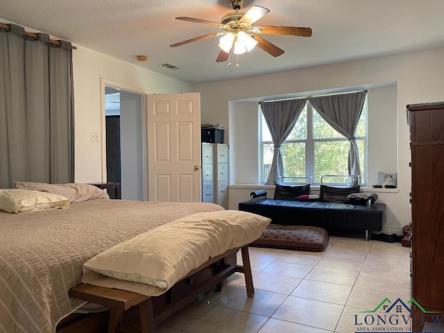 bedroom featuring ceiling fan and light tile patterned floors