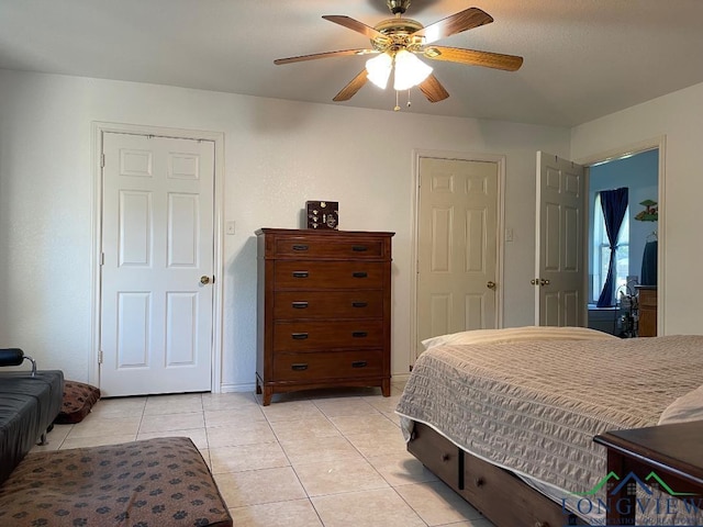 tiled bedroom with ceiling fan