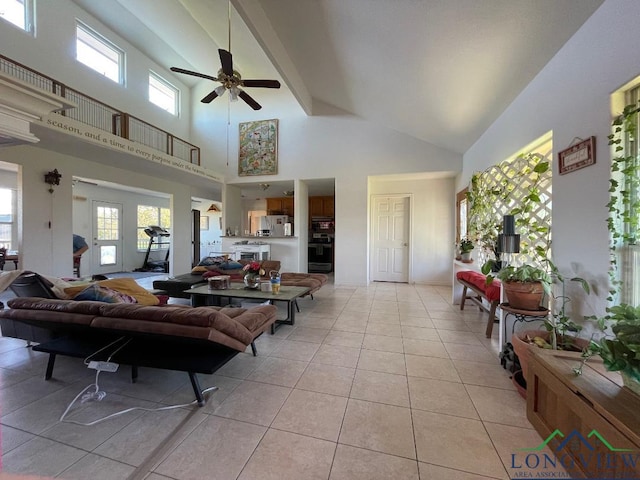 tiled living room featuring a high ceiling and ceiling fan