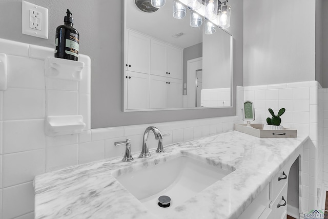 bathroom featuring visible vents and vanity