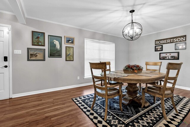 dining area with crown molding, a chandelier, and dark wood-style flooring