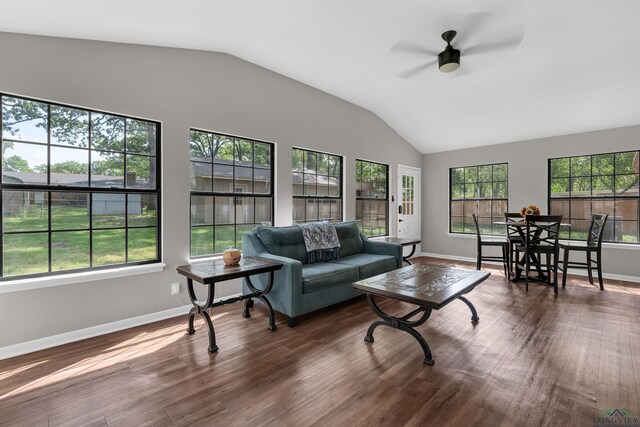 living room with lofted ceiling, baseboards, wood finished floors, and ceiling fan
