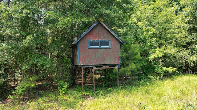 view of outdoor structure with a wooded view