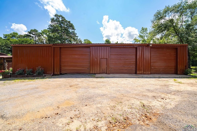 view of gate featuring an outdoor structure