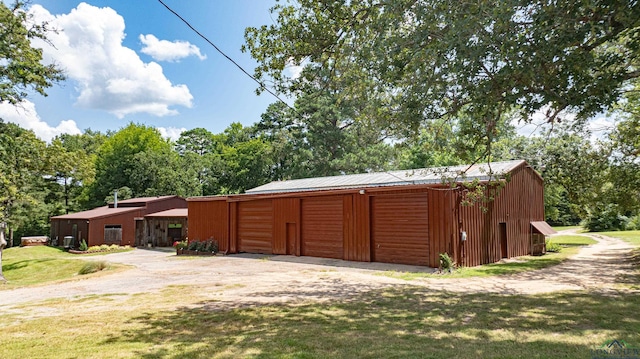 exterior space featuring a garage and a front lawn