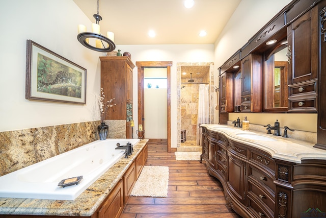 full bathroom with recessed lighting, a stall shower, wood tiled floor, vanity, and a tub with jets