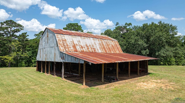 view of barn with a lawn