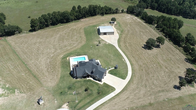 birds eye view of property with a rural view