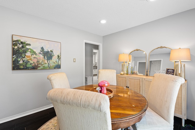 dining space with recessed lighting, baseboards, and dark wood-style floors