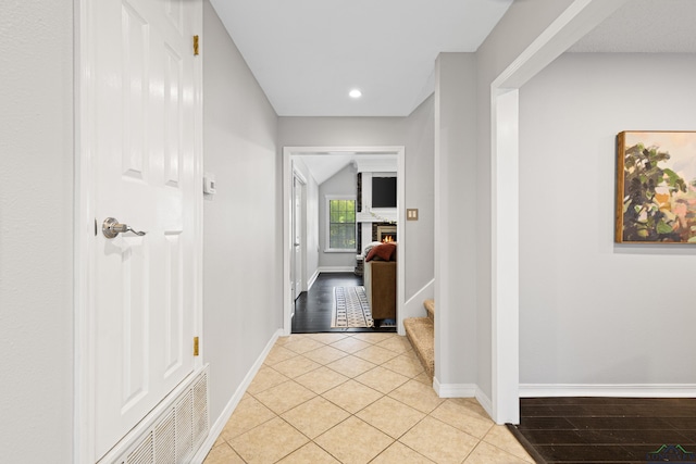 hall with stairs, baseboards, light tile patterned flooring, and recessed lighting