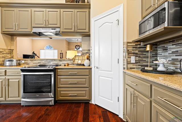 kitchen with dark wood-style floors, backsplash, appliances with stainless steel finishes, and under cabinet range hood